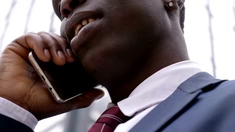 Business,-success-close-up-on-black-american-businessman-talking-on-the-phone