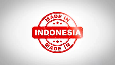 Made-In-INDONESIA-firmado-sellado-Sello-madera-animación-de-texto.-Tinta-roja-en-el-fondo-de-superficie-de-papel-blanco-limpio-con-verde-mate-fondo-incluido.