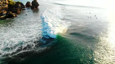 Aerial-view-of-barrel-wave-in-tropical-ocean,-Bali