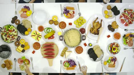 Top-view-of-Group-of-asian-people-toasting-at-table-together-and-celebrating-Christmas-with-delicious-meal-at-new-year-party.-People-with-holidays-and-celebration-concept.