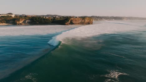 Aerial-view-with-big-ocean-waves.-Surfing-and-waves-in-Bali-at-sunset.