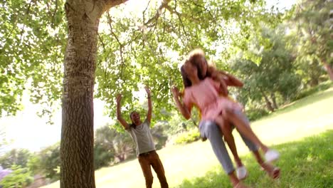 Attractive-mom-and-daughter-shares-a-swing-together