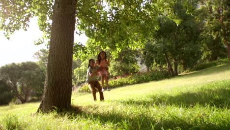 Wide-angle-shot-of-beautiful-young-girl-on-swing.