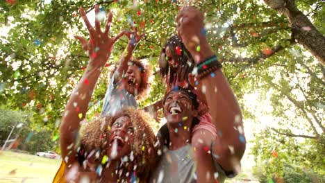 Excited-african-american-family-laughing-and-enjoying-the-moment-with-confetti