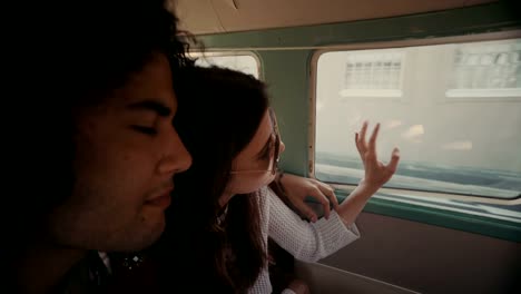 Young-hipster-couple-enjoying-a-road-trip-on-vintage-van