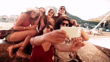 Multi-Ethnic-Hipster-Group-at-harbour-Taking-Road-trip-Selfie