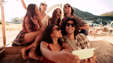 Multi-Ethnic-Hipster-Group-at-harbour-Taking-Road-trip-Selfie