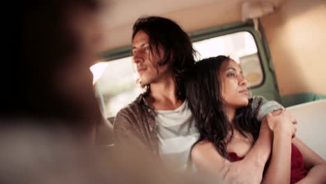 Young-hipster-couple-enjoying-a-road-trip-on-vintage-van