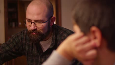 A-father-and-son-playing-a-board-game-together-at-home