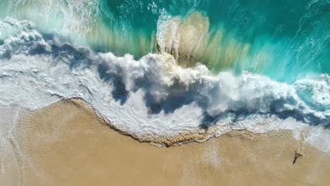 Aerial-view-of-ocean-waves-crashing-on-beach-by-4K-drone-footage.