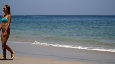 Girl-comes-out-of-the-sea-after-swimming