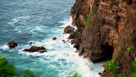 Uluwatu-stone-cliffs,-ocean-waves.-Aerial-top-view.-Bali,-Indonesia.