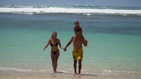 Family-with-child-on-the-beach