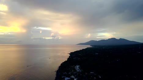 Pemuteran,Aerial-view-from-drone,Stony-seacoast-and-mountains-on-a-sunset.-Indonesia.-Bali