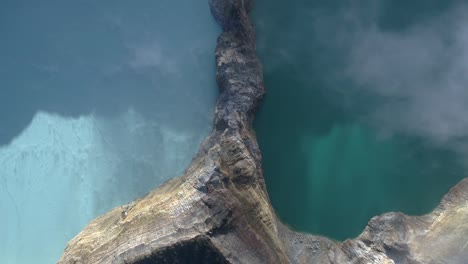 Kelimutu-tri-coloured-volcano-crater-covered-with-mist-an-aerial-view-early-morning