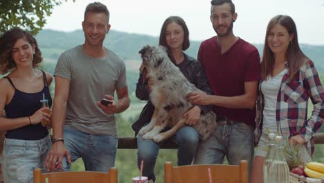 group-of-friends-having-a-break-in-the-countryside--with-a-funny-dog.-shot-in-slow-motion