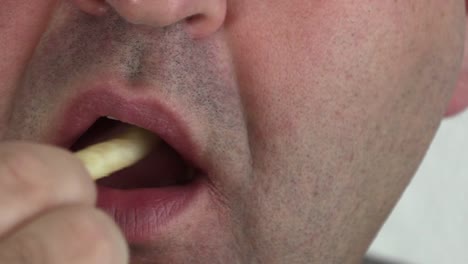 A-Man-eating-French-fries-with-Tomato-Ketchup