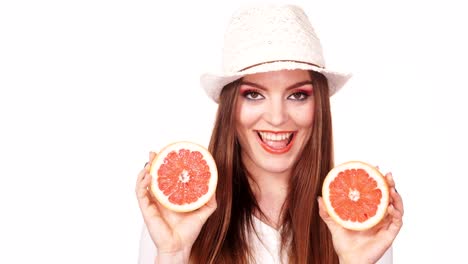 Woman-joyful-girl-holds-grapefruit-citrus-fruit-in-hands-4K