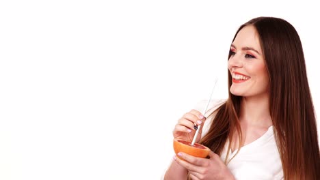 Woman-holds-grapefruit-drinking-juice-from-fruit-4K
