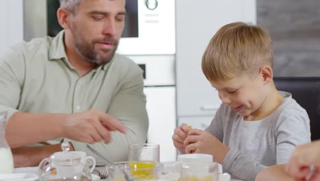 Father-Taking-Care-of-Kid-at-Breakfast