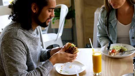 Couple-having-food-in-restaurant-4k