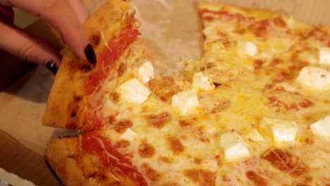 slice-of-pizza-in-hand