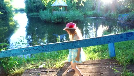 Little-girl-with-long-hair-eats-ice-cream-in-the-park.