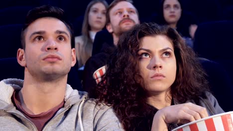 Couple-watches-horror-at-the-movie-theater