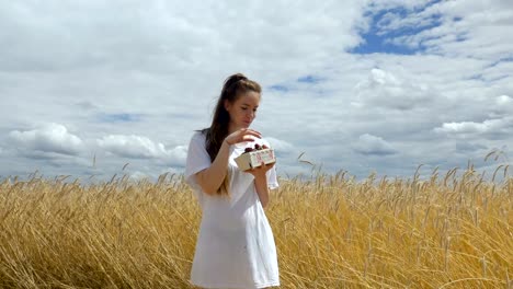 Happily-Eating-Strawberries-in-a-Wheat-Field