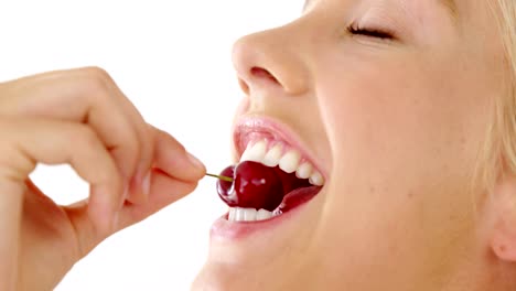 Clos-up-of-beautiful-woman-eating-cherry