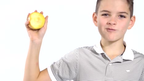 Little-boy-wearing-t-shirt-eat-apple-at-white-background