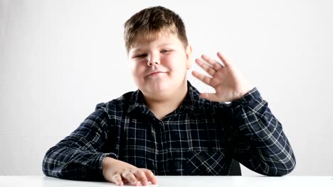 Young-fat-boy-waving-his-arm,-hello-sign-50-fps