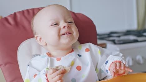 A-Baby-Girl-Eating-Bread-at-Home