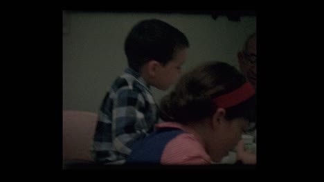 Grandfather-and-grandkids-at-dinner-table