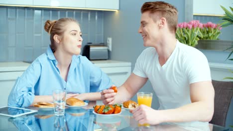 Affectionate-couple-relaxing-in-bright-apartment.