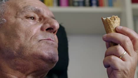 greedy-old-man-alone-eating-icecream--indoor