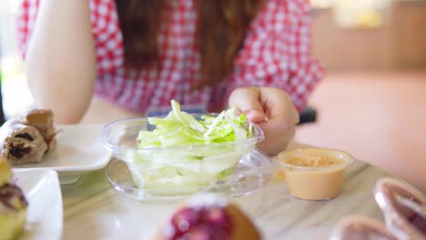 Asian-girl-chatting-with-friends-at-lunch-time