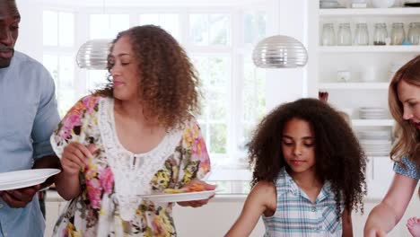 Group-of-family-and-friends-meeting-for-lunch-party-in-kitchen