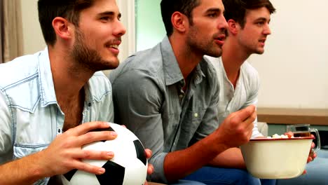 Happy-friends-watching-a-football-match