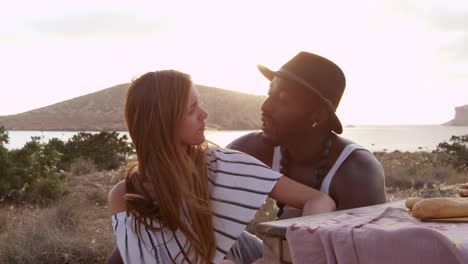 Couple-Enjoying-Picnic-On-Cliffs-By-Sea-Shot-On-R3D