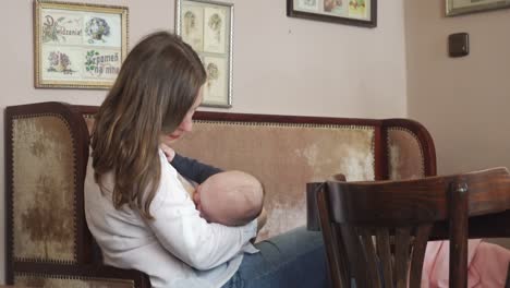 A-Woman-Breastfeeding-her-Child-in-a-Cafe