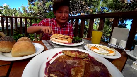 Preteen-boy-eating-breakfast-and-crying