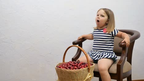 Little-girl-choke-on-a-cherry-stone-during-eating-the-berry