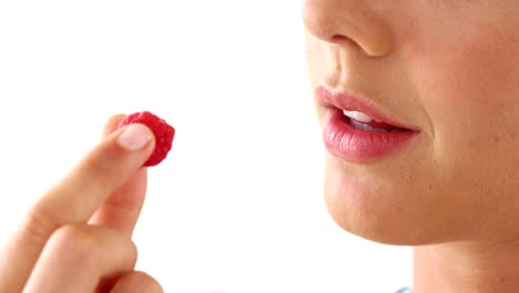 Close-up-of-woman-having-raspberries