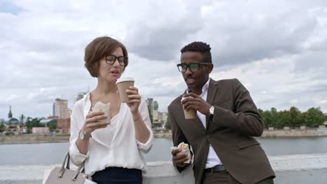 Colleagues-Eating-Fast-Food-Lunch-Outdoors