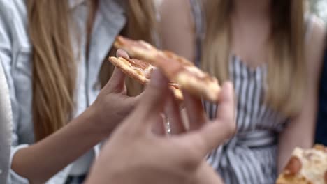 Close-Up-of-Hands-Holding-Pizza-and-Coke