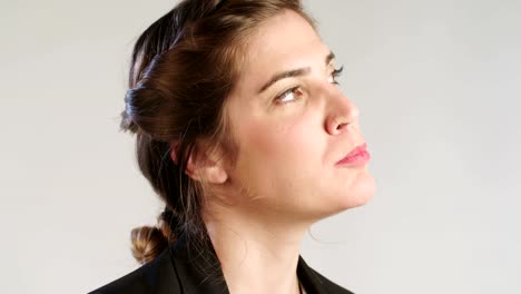 close-up-of-a-woman-eating-an-apple-on-a-white-studio-background