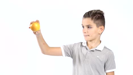 Cute-little-boy-eats-apple-at-white-background