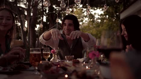 Young-happy-friends-at-traditional-feast-in-mediterranean-village