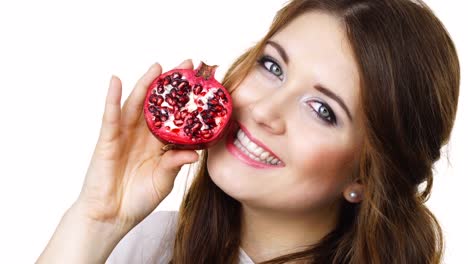 Woman-holds-half-of-pomegranate-fruit,-isolated